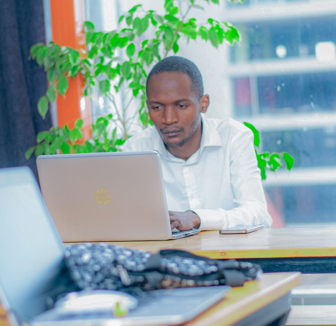 antony wainaina working on a laptop